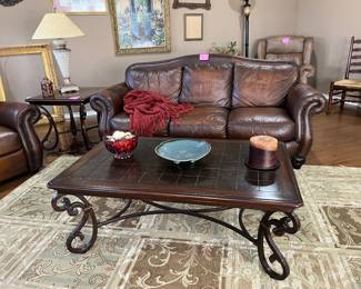 Leather sofa with nailhead trim and matching recliner