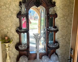 Turn of the Century Victorian antique walnut Hall Tree, with marble shelves and mirror and an array of striking American Brilliant crystal pieces