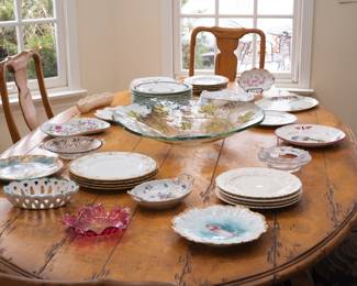 Antique cranberry art glass dish, multiple pieces of German, Limoges, and English porcelain plates