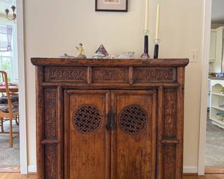 Antique carved Chinese cabinet with double doors, interior fitted with two compartments and two drawers