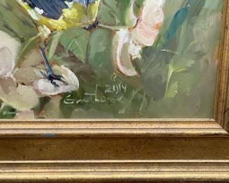 Closeup of framed painting of a bird perched on flowers, signed and dated 2014