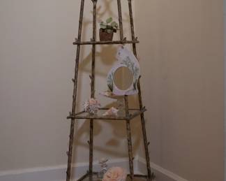 Wrought iron whatnot display stand with three glass shelves, the frame in faux bois branch/twig form