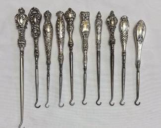 Selection of antique sterling silver handled button hooks