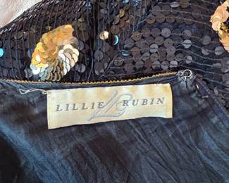 Closeup of Lillie Rubin black and gold sequin top with giraffe design