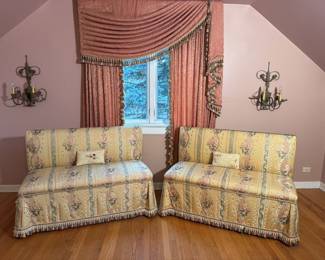 Pair of fine skirted loveseats in pale gold and striped upholstery