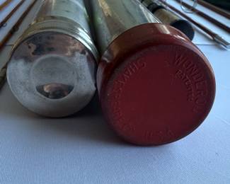 Closeup of Fly fishing rods with metal tube cases