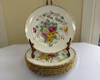 Set of Tuscan fine bone china plates made in England; central floral pattern with gold trim on scalloped edge