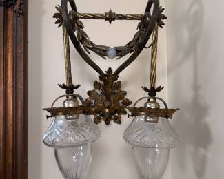 Closeup of the pair of gorgeous antique sconces with four matching acorn shaped cut glass shades