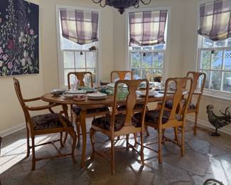 Large oval pine dining table with 6 chairs