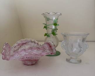 Art glass including a striped pink and clear ruffled edge glass dish, a clear glass vase with green stems and flowers around the body, with green foot; and a signed Lalique crystal Art Deco "Dampierre" bird vase.