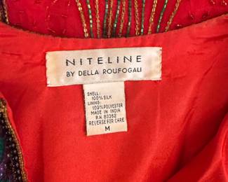 Closeup of 1980's red silk beaded jacket by Della Roufogali for Niteline, size M