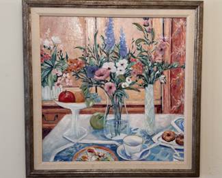 Signed oil on canvas painting, interior scene of table set with vases of flowers, cup and saucer, plates of food,