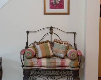 Antique wrought iron crib made into a bench with arms