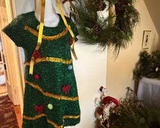 A green short sleeved "Christmas Tree" dress, and other Christmas / holiday themed decorations