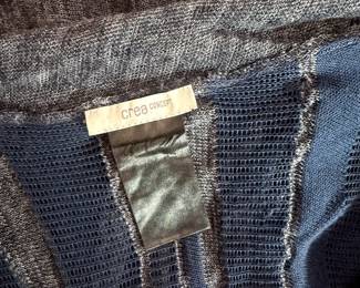 Closeup of CREA Concept long sleeve blue knit top, NWT new with tag