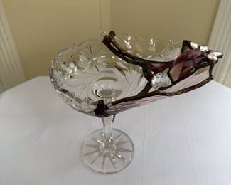 Art glass piece — a cut glass compote reconfigured with lead and found glass