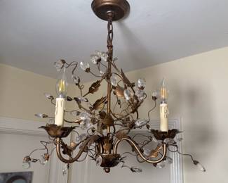 A bronze three-light chandelier, leafy branches and crystal blossoms