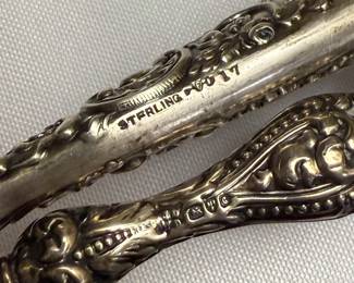 Closeup of the selection of antique sterling silver handled button hooks