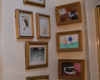 Framed drawings and cat photos