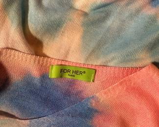 Closeup of For Her long sleeved pullover sweater, floral design over pastel tie dye pattern