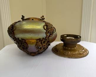 A lovely antique Art Nouveau era iridescent blown cased glass ceiling mount light fixture with bronze floral scrolls and repoussé base