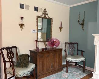 Carved Chippendale style arm chairs, a bar cabinet with expandable top, more art glass pieces, Adams style mirror, and Italian carved gilt wood wall shelves