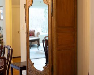 Single door antique carved armoire fitted with shelves
