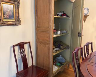 Interior of the single door antique carved armoire fitted with shelves