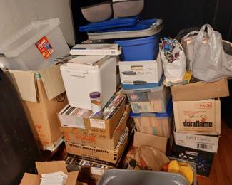 Boxes and boxes of media, odds and ends, house wares, vintage paper, vintage photos, video game guides and much much more.