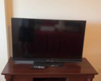 42 Sharp Television, Samsung DVD Player, TV Stand And Print