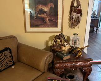 Double tan leather chair & ottoman, ornate end table( matches other tables), Indian dream catcher,