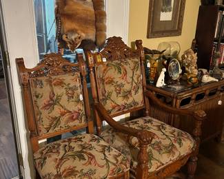 Gorgeous hand carved faces on these chairs in excellent condition 