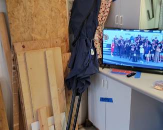Outdoor umbrellas. Roku TV. Misc. wood scraps.