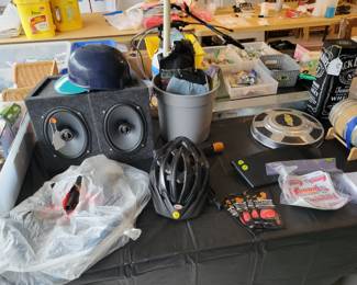Speakers, bike helmet, vintage Chevy hubcap. Vintage Mariners batting helmet.