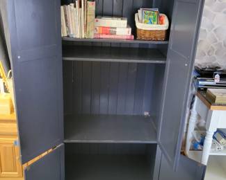 Variety of cookbooks, pine TV armoire.