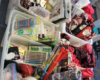 Knitting supplies. An abundance of knitting needles and knitting pattern books.