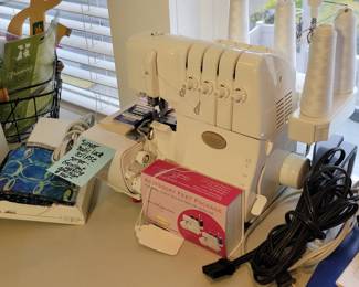 Singer Baby Lock Serger. Box of attachments sold separately.