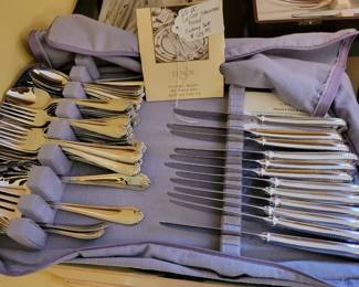 65 piece Lenox "Bead" pattern stainless cutlery set. Like new condition.