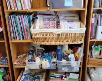 Quilting books and patterns, baskets of homemade quilt binding. Quilting fabrics.