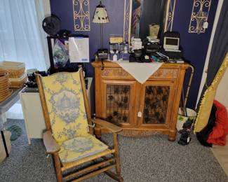 Wine cabinet, antique rocking chair with custome cover, cameras, 3D printer, scotty dog doorstop, lamp, wall sconces.