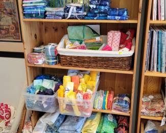 The wall of batiks, Jelly rolls and layer cakes.