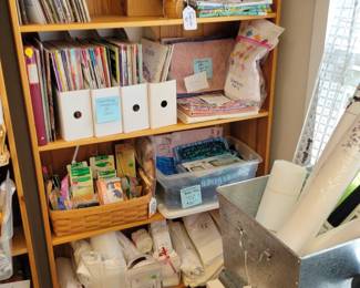 Quilting magazines, Monopoly crossstitch project and quilting fabric, bias tape makers, tons of white fabric.