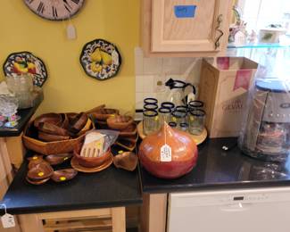 Vintage monkey pod salad set and various serving pieces. New Gevalia coffee maker, gourd with bread warmer. Mexican glass glasses and pitcher.