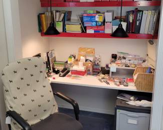 Office chair, assortment of office supplies.