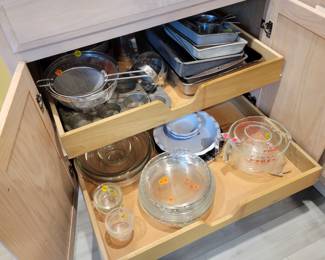Baking pans, Pyrex pie plates and mixing bowls. Emile Henry pie plates. Muffin tins, colanders.