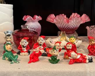 Collection of pixies with a bit of Fenton hobnail cranberry glass in the background