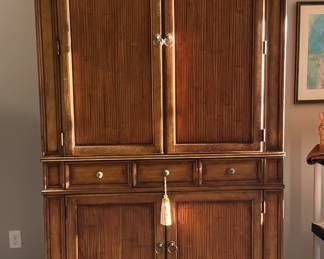 Large armoire with rattan accents