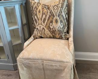 One of a pair of captains chairs for a dining room table. Six side chairs are also available.
