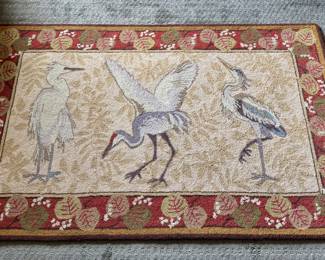 Hooked rug by Claire Murray featuring herons