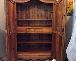 The roomy interior of the armoire.